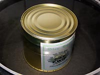 The tin with the concentrate is heated in order to make it liquid